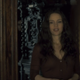 Some dead guy (background) and Carla Gugino (foreground) in The Haunting Of Hill House